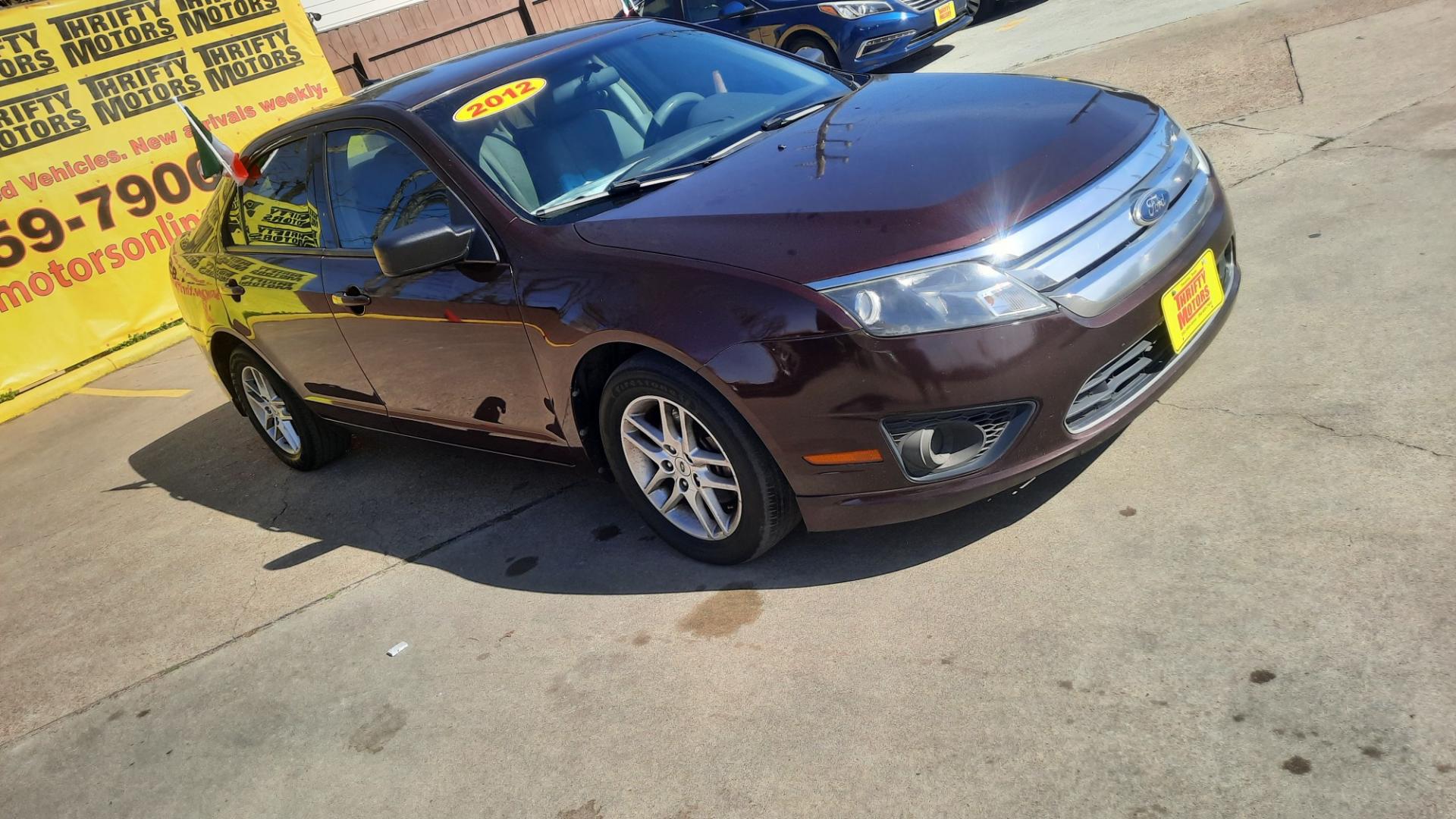 2012 Ford Fusion (3FAHP0GAXCR) , located at 16710 Clay Rd., Houston, TX, 77084, (281) 859-7900, 29.834864, -95.656166 - Photo#2